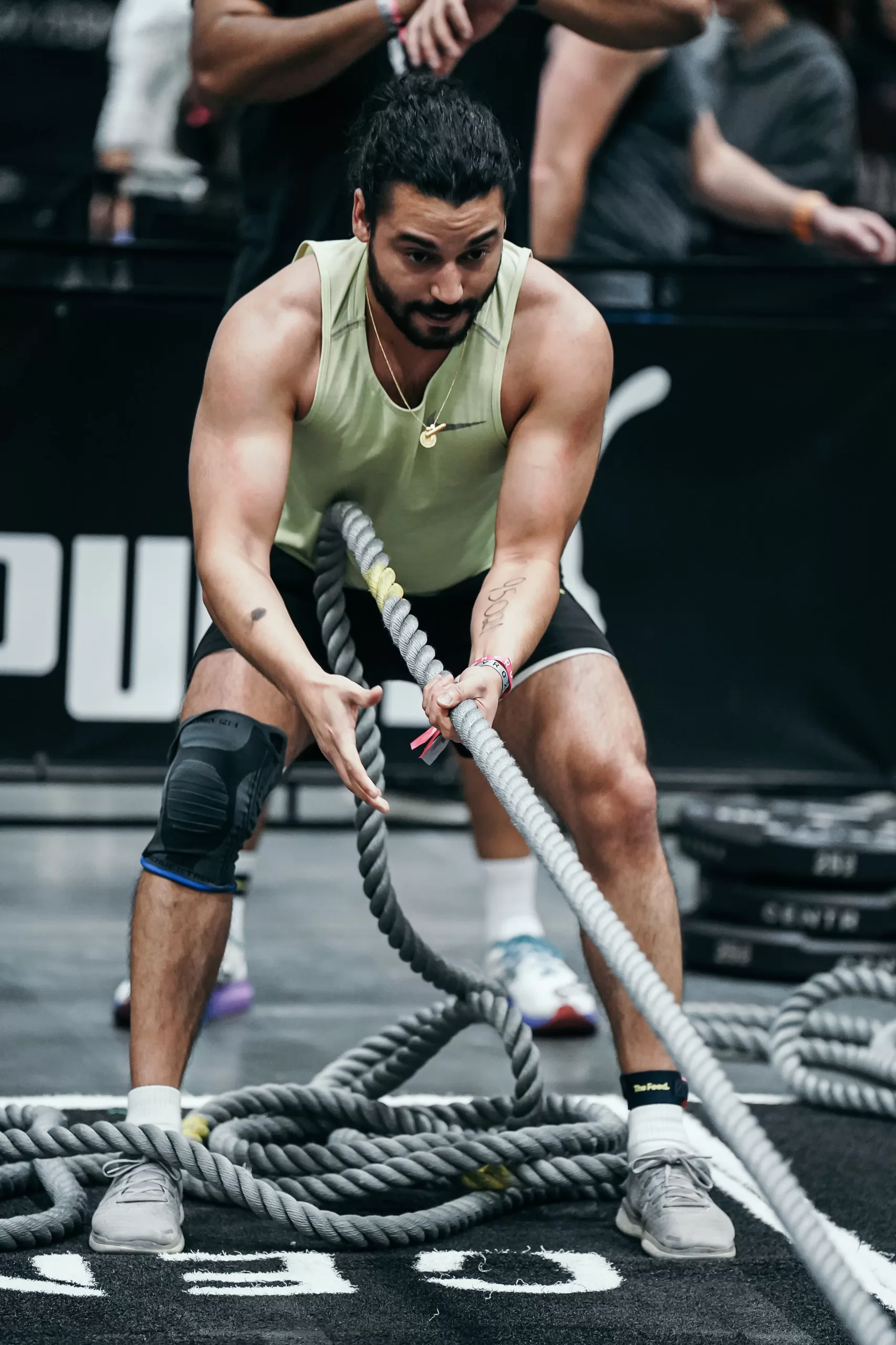 Athlete training with battle ropes at Volt Health